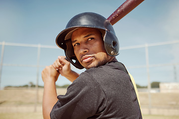 Image showing Baseball player, man and fitness athlete train for baseball competition on pitch field outdoors. Sports wellness workout, healthy lifestyle and man in sport safety helmet with bat at stadium outside