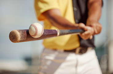 Image showing Baseball, bat and ball being hit on a field at a sports training, practice or competition game. Softball, sport equipment and man athlete practicing to swing a wood baton on outdoor pitch or stadium.