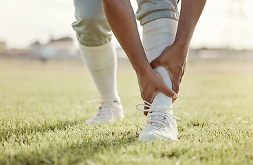 Image showing Sports, field and man with ankle injury after game, competition or baseball performance workout. Emergency, training accident or athlete legs in pain after fitness, exercise or running on grass pitch