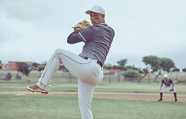 Image showing Baseball, sports and man throwing a ball during a professional game on a field with a team. Athlete pitching during an event for sport, competition or training with focus, balance and speed at a park