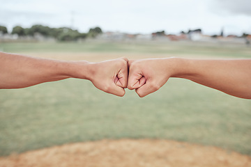 Image showing Hands, fist bump and friends outdoor in nature for partnership, friendship and support on a field. Baseball or softball pitch, team building and men athletes doing a solidarity gesture together.