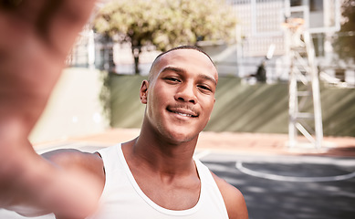 Image showing Sports, smile and man taking a selfie on a basketball court after fitness training, cardio exercise and workout. Smile, portrait and happy black man taking pictures or photo outdoors in Chicago, USA