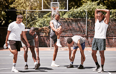 Image showing Fitness, exercise and basketball men stretching or workout their body on a sport court. Training male athletes prepare muscle warm up before practice or game at a sports venue or club for health