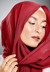 Image showing Hijab, muslim and fashion of woman in beauty headshot with red lipstick, makeup or cosmetics in studio background mock up. Islamic culture, fabric and designer arabic model wearing scarf with mockup