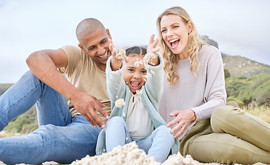 Image showing Children, family and beach with girl, mother and father playing in the sand while bonding on holiday or vacation. Travel, kids and summer with a woman, man and daughter bonding together at the coast