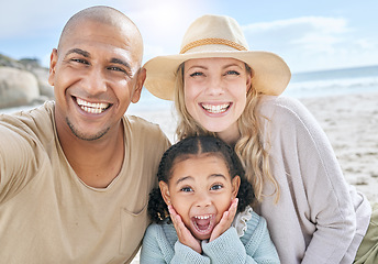 Image showing Selfie, beach and portrait of a happy family on vacation together in nature by the ocean. Happy, smile and parents with their girl child taking photo while relaxing at seaside on holiday or adventure