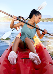 Image showing Lake, friends and kayak adventure with water sport on travel trip canoeing, kayaking and using paddle on calm nature river. Exercise, vacation or holiday with women enjoying boat activity in summer