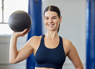 Image showing Sports, training and woman with a medicine ball for exercise, fitness and body goal at gym. Portrait of happy, healthy and athlete with a smile for workout for wellness at club for health and cardio