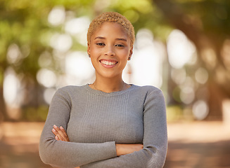 Image showing Nature, park and portrait of woman with arms crossed, happy and smile on face. Young black woman enjoying weekend, freedom and holiday, standing in forest for happiness, adventure and relax outdoors