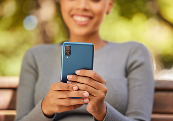 Image showing Smartphone, smile and woman hands while streaming in a nature park, online subscription or social media post. 5G communication, smile and happy girl reading internet news or networking with contact