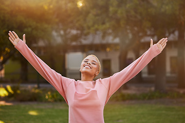 Image showing Freedom, nature and happy woman in park to relax and have fun outdoor in nature for peace, quiet and freedom mindset. Happiness, fitness and spiritual zen girl with arms outstretched being mindful