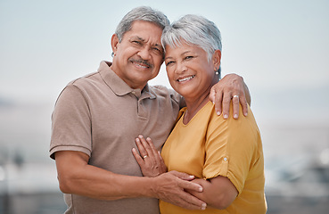 Image showing Happy, love and portrait of a senior couple in retirement, bonding and embracing in nature. Happiness, smile and elderly man and woman from Puerto Rico hugging with care, romance and joy outdoors.