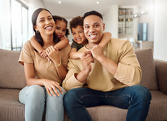 Image showing Family, mother and father with hugging kids relaxing on living room sofa with smile for quality bonding time at home. Portrait of happy mama, dad and children smiling in happiness for break together