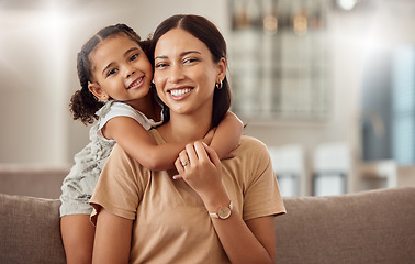 Image showing Black family, hug and portrait of child with mother, mom or mama bond, relax and enjoy quality time together. Love, happy family and woman with kid girl smile, care or lounge on home living room sofa