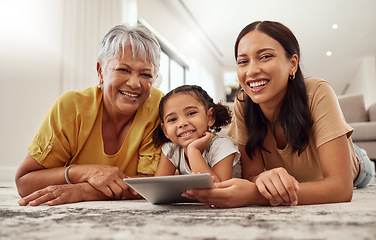 Image showing Child, grandma and mother portrait with tablet on floor of living room for movie streaming. Happy family, love and smile of women bonding with digital app entertainment at home in Mexico.