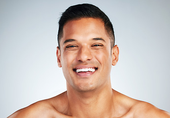 Image showing Man face, skin and teeth, natural beauty and skincare, happy model in cosmetology advertising. Clean and fresh, glow and facial treatment, body wellness or dental mouth hygiene in studio background.