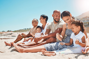 Image showing Happy, family and relax with smile on beach for summer vacation and bonding time together in nature. Mother, father and grandparents with children relaxing on sandy shore smiling for holiday travel