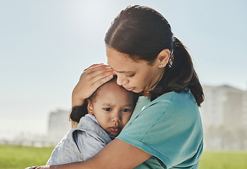 Image showing Woman, child and sad with comfort, love and care in hug, embrace and holding outdoor at park. Mom, kid and together for support, attention and help for depression, mental health and problem in sun