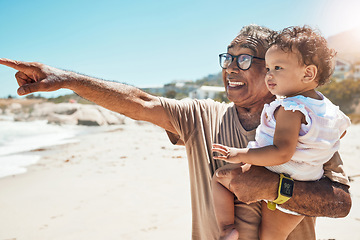 Image showing Grandpa, baby or bonding on beach holiday in Mexico ocean or sea for summer family holiday. Fun, smile and happy senior man carrying girl, kid or child playing in nature environment on vacation