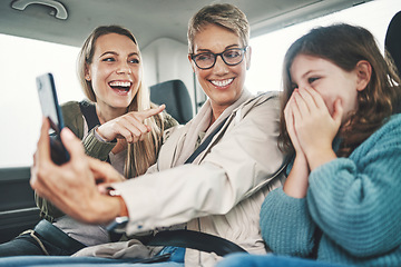 Image showing Phone, road trip or travel with a family selfie of a girl, mother and grandmother in a car for a holiday or vacation. Bonding, photograph and transport with a woman, child and grandchild traveling