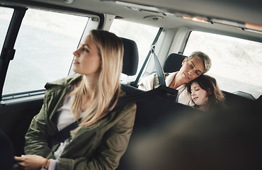 Image showing Road trip, driving and family sleeping in the car tired from adventure, holiday and travelling on road. Travel, transport and girl asleep with grandmother in motor vehicle on drive home from vacation