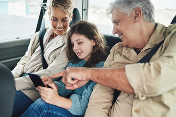 Image showing Child, grandparents and phone on road trip in car backseat streaming movie, elearning or helping with education game. Child, man and woman uber happy on travel journey and checking destination online