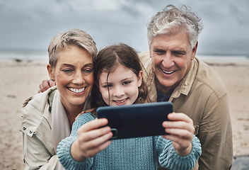 Image showing Phone selfie, beach and grandparents with child bond on relax adventure, fun travel journey or Sydney Australia vacation. Memory picture, love and happy family of grandpa, kid girl and grandma smile