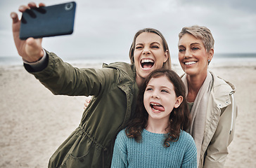 Image showing Beach, grandma and child selfie with phone for happy family holiday break together in Canada. Mother, daughter and grandmother capture joyful picture for social media on ocean leisure walk.