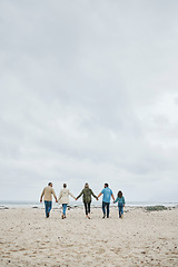 Image showing Holiday, family and walking beach in summer vacation, travel and freedom in South Africa. Love, freedom and care grandparents, parents and kid relax, bond and enjoy winter ocean trip together