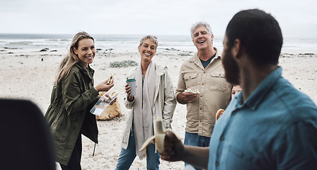 Image showing Big family, beach food and lunch on vacation, holiday or trip outdoors. Love, generations and family eating bananas at sandy seashore, having fun and talking, spending good time together and bonding.