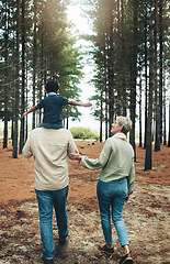 Image showing Family, grandparents and walking with child in a forest for happy, health and love together. Care, love and woods with elderly couple and kid in nature for bonding, smile and happiness in autumn