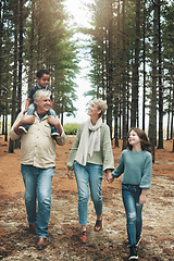 Image showing Family, grandparents and children in forest adventure together for quality bonding time in nature. Happy grandpa, grandma and kids enjoying a fun walk, hike or stroll in the woods in the outdoors