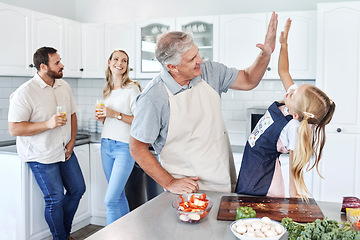 Image showing High five, happy family and cooking together success in kitchen bonding activity. Parents smile, senior man teach kid to make healthy lunch and good job child development through learning at home