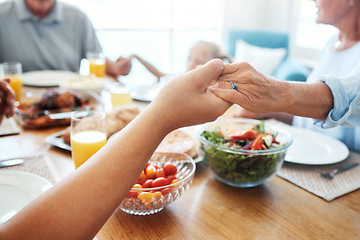 Image showing Christian, family and pray for food holding hands for lunch together at home dining table. Faith, gratitude and prayer of thanks to God for meal with young and senior relatives in house.