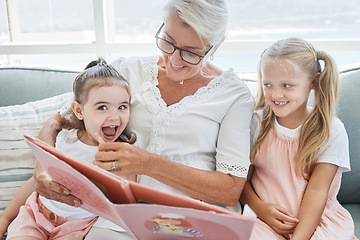 Image showing Grandmother, children and reading books on living room sofa in family home educational learning, funny and happy development. Grandma, girls and girl kids laughing, teaching story and relax on couch