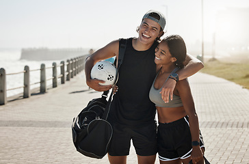 Image showing Couple, sport and fitness, soccer and soccer ball by beach together after training and workout. Young man hug black woman, exercise outdoor and sports motivation, athlete with active lifestyle.