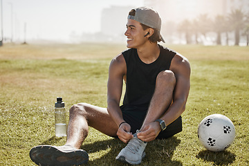 Image showing Soccer field, sports gear and man on field, tying shoe laces for competition, game prepare or outdoor training. Gen z college or university person with sneakers for outdoor football practice on pitch