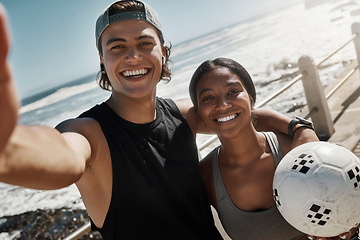 Image showing Selfie, friends and soccer for exercise by beach, for training and wellness with ball, smile and happy outdoor. Workout, man and healthy woman being relax, fitness and cheerful for health or football