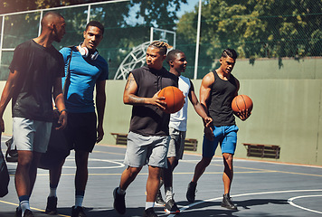 Image showing Sports, team and basketball player friends walking off together after street game, competition or practice match. Basketball court, fitness and black people talking after workout or training exercise