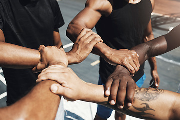 Image showing Diversity team, friends and basketball holding hands for trust, partnership or community goal on New york basketball court. Motivation, support or sports unity for fitness, training or health workout