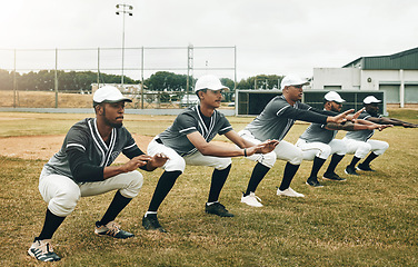 Image showing Sports, baseball and team stretching in training, exercise and fitness workout on a baseball field in Houston, USA. Teamwork, softball and healthy group of men ready to start playing a match game