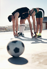 Image showing Athletes stretching, soccer player and couple workout on rooftop for sports fitness exercise in summer sun. Urban sports, football player training and stretch together for cardio health cityscape run