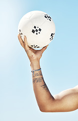 Image showing Arm, hand and holding soccer ball, sports and fitness, muscle and strong, athlete training outdoor with blue sky. Sport motivation, soccer and closeup, exercise and workout for healthy active living.