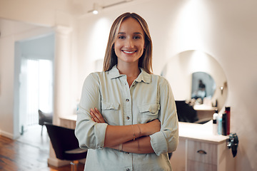 Image showing Salon, small business and owner with a woman stylist standing arms crossed in her workshop. Hairdresser, startup and entrepreneur with a female beautician working in the beauty or hair industry