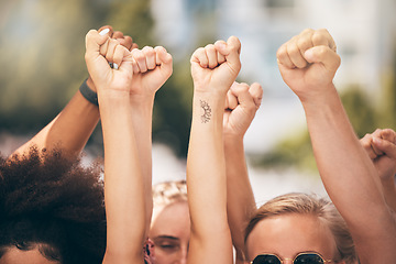 Image showing Protest, group and fist of people, hands in air for solidarity, equality and power women together outdoor. Diversity, strong and motivation people in crowd support of freedom revolution and justice