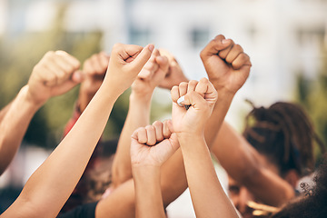 Image showing Hands, protest and community with a group of people fighting for change or human rights in the city. Freedom, collaboration and politics with a crowd standing for climate change or equality outdoor