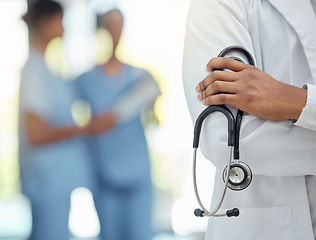 Image showing Hospital, medical and hands of doctor with stethoscope for professional cardiology exam closeup. Healthcare, cardiologist and diagnostic equipment for heart expert treatment in workspace.