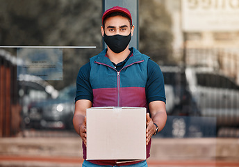 Image showing Delivery man, box and covid face mask working for courier service with package, shipment or parcel outdoor. Express, logistics and portrait of guy ready to deliver ecommerce order during coronavirus