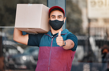 Image showing Thumbs up, box and man with face mask for delivery with export or transportation service. Success, logistics and portrait of courier guy with approval gesture to deliver package during covid pandemic