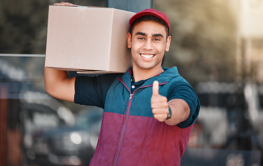 Image showing Portrait, box and delivery worker with thumbs up gesture and a big smile carrying cargo, stock or a package. Happy delivery man with a thumb up holding a cardboard packaging or mail post outdoors